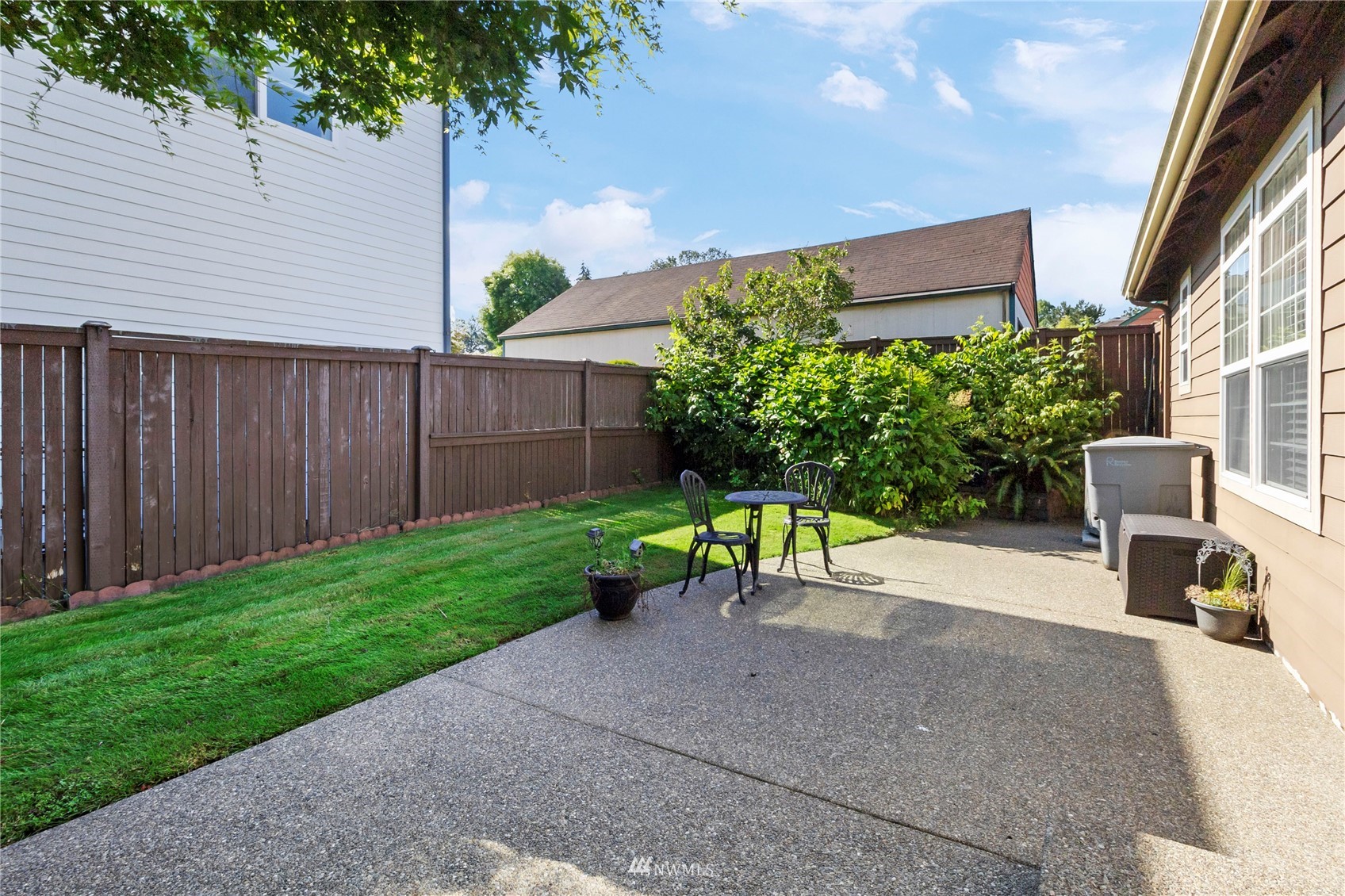 3904 Park Avenue North Renton, WA 98056 - Photo 38 of 40 a view of a backyard with furniture and garden