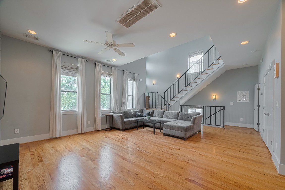 2115 Hadley Street Houston, TX 77003 - Photo 11 of 34 a living room with furniture and a chandelier