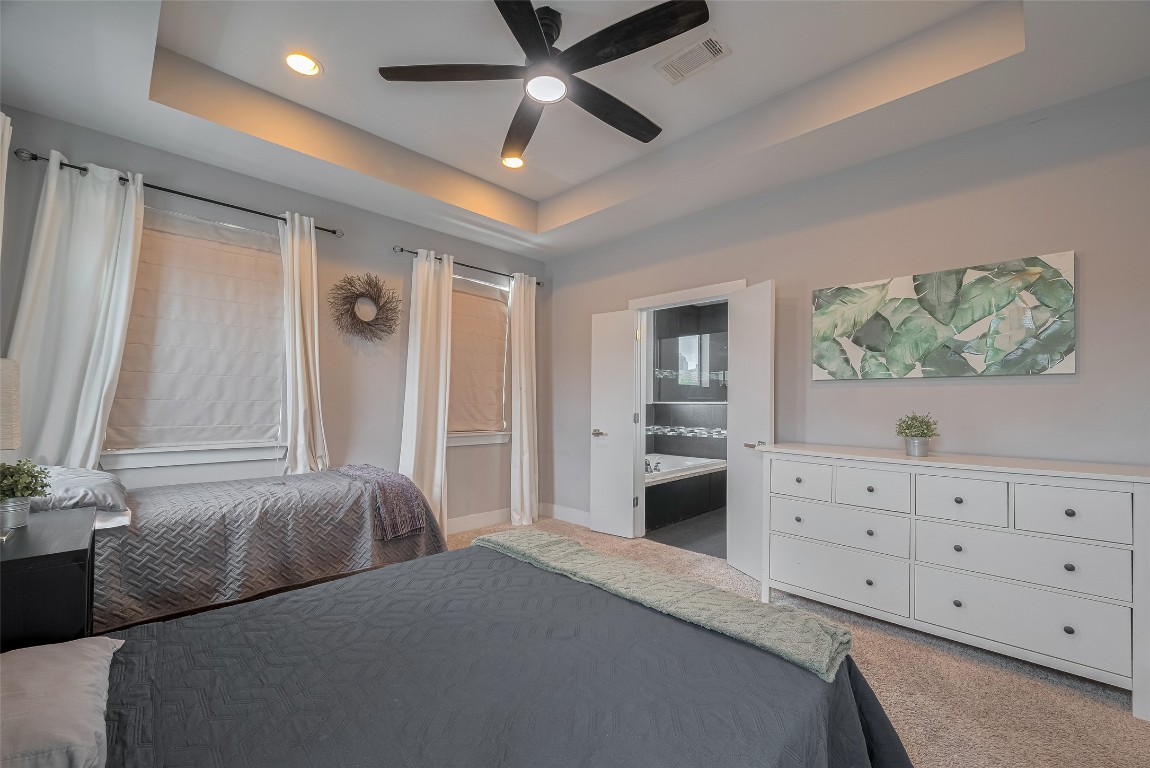2115 Hadley Street Houston, TX 77003 - Photo 17 of 34 a bedroom with a bed and a dresser