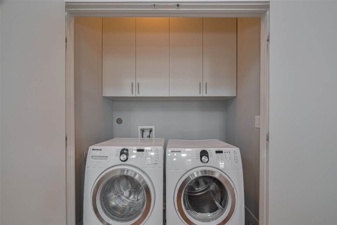 2115 Hadley Street Houston, TX 77003 - Photo 32 of 34 a view of storage and utility room with washer and dryer