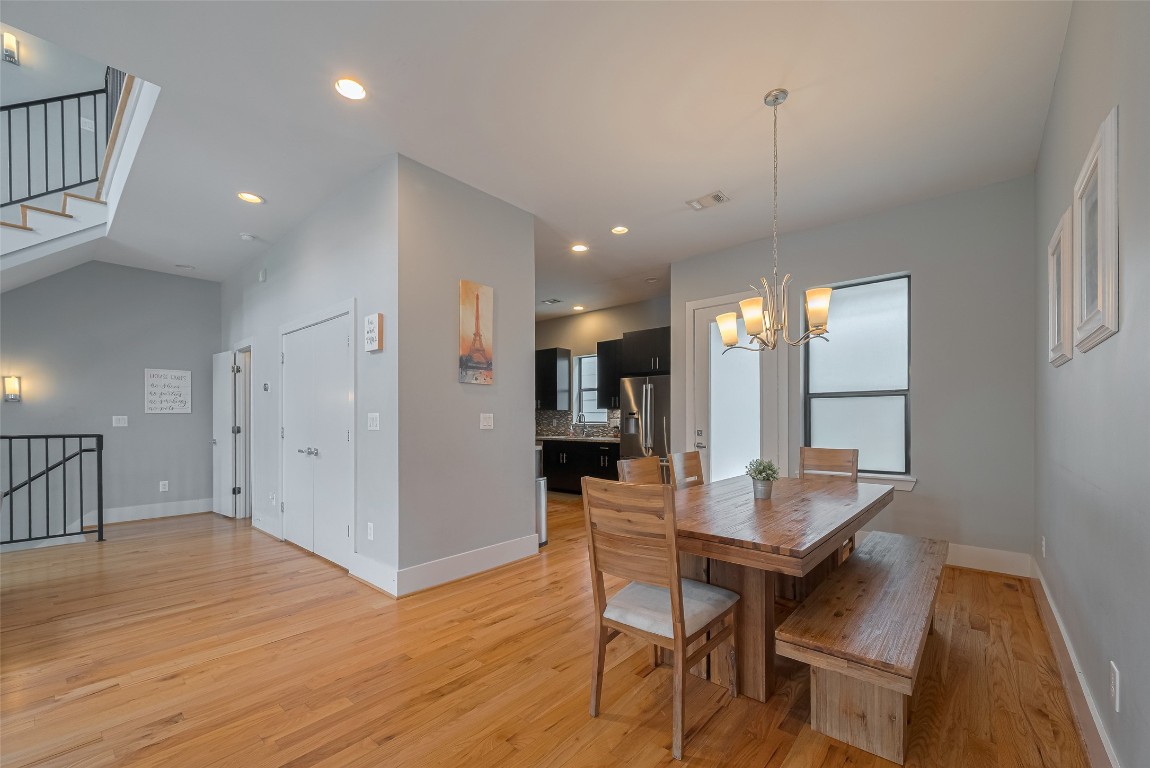 2115 Hadley Street Houston, TX 77003 - Photo 8 of 34 an open kitchen with dining table and wooden floor