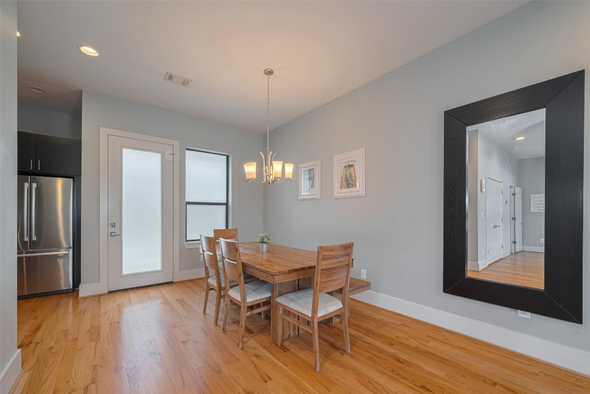 2115 Hadley Street Houston, TX 77003 - Photo 10 of 34 a view of a dining room with furniture and wooden floor