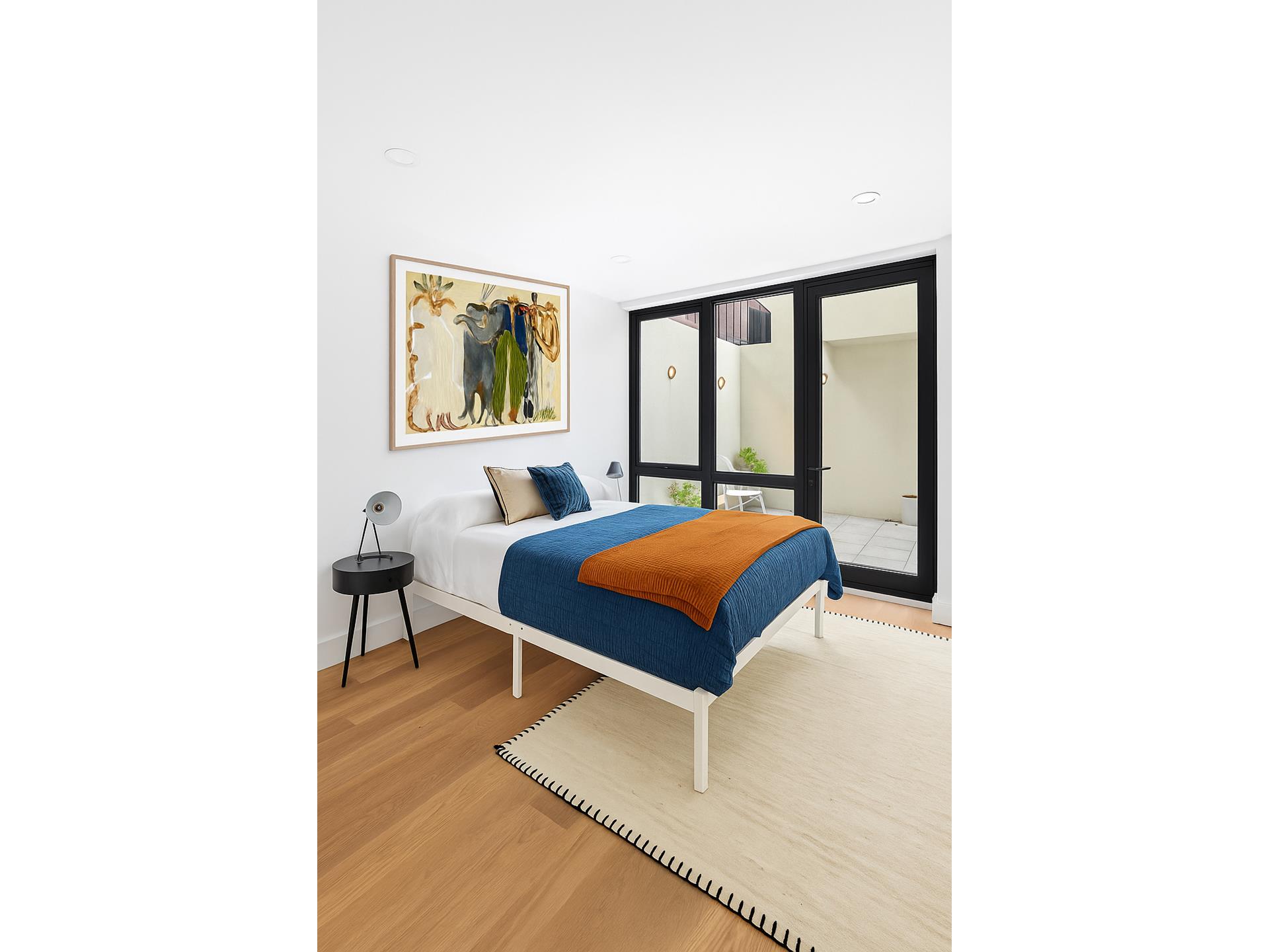 218 Classon Avenue, Unit GARDEN Brooklyn, NY 11205 - Photo 12 of 18 a bedroom with a bed and a painting on the wall