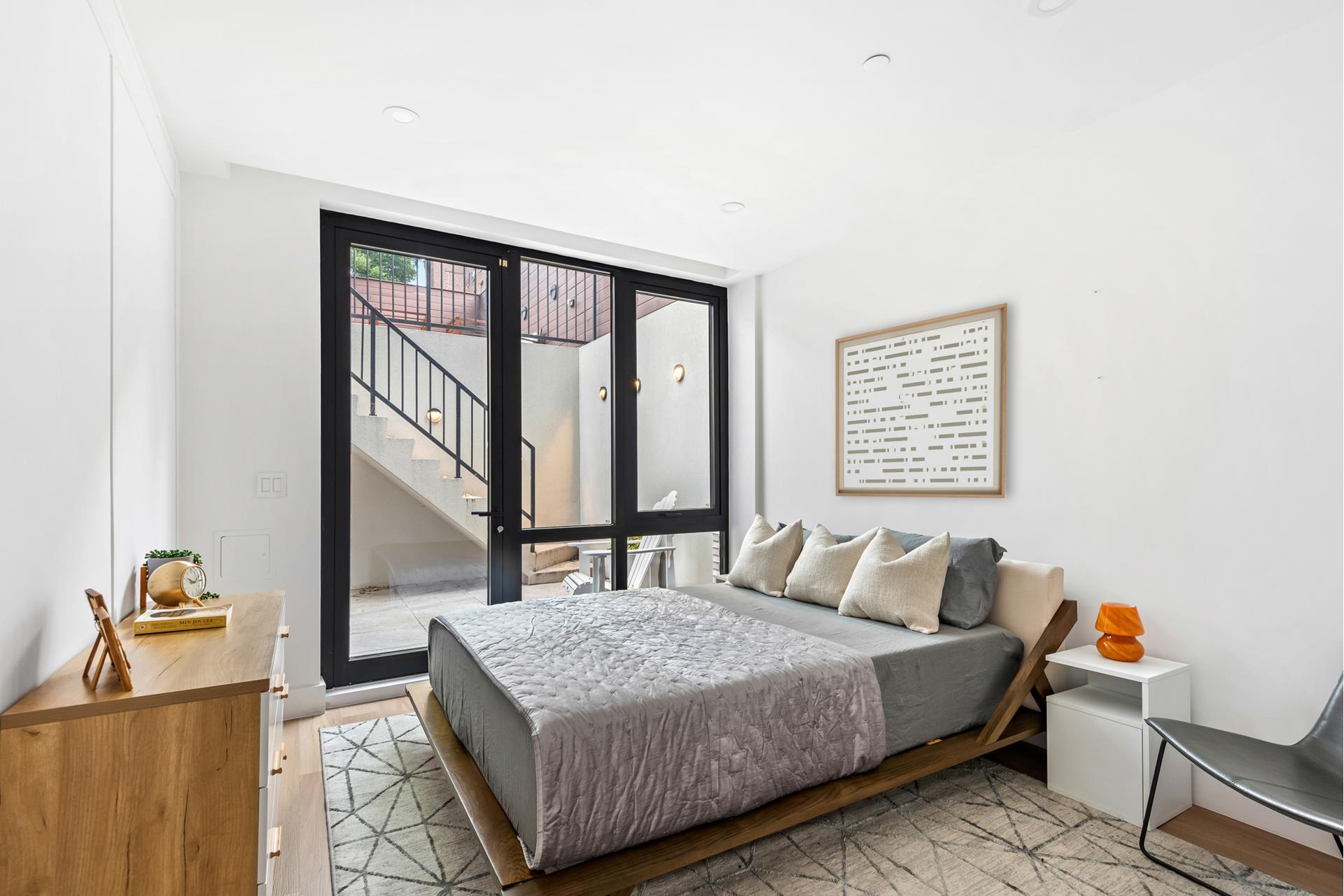 218 Classon Avenue, Unit GARDEN Brooklyn, NY 11205 - Photo 9 of 18 a bedroom with a bed and a window