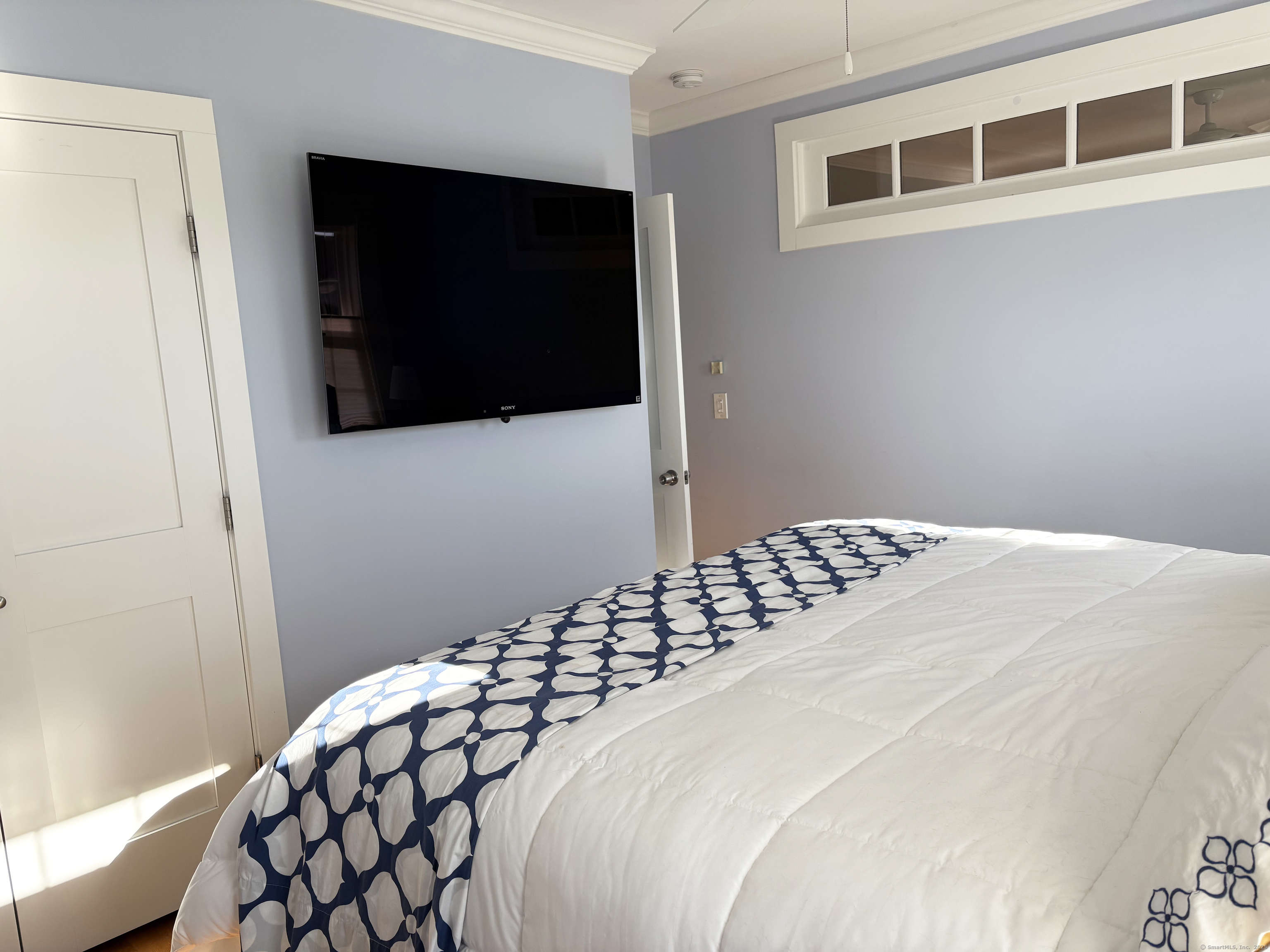 20 Haddon Street, Unit 5 Bridgeport, CT 06605 - Photo 15 of 40 a bedroom with a bed and a flat screen tv