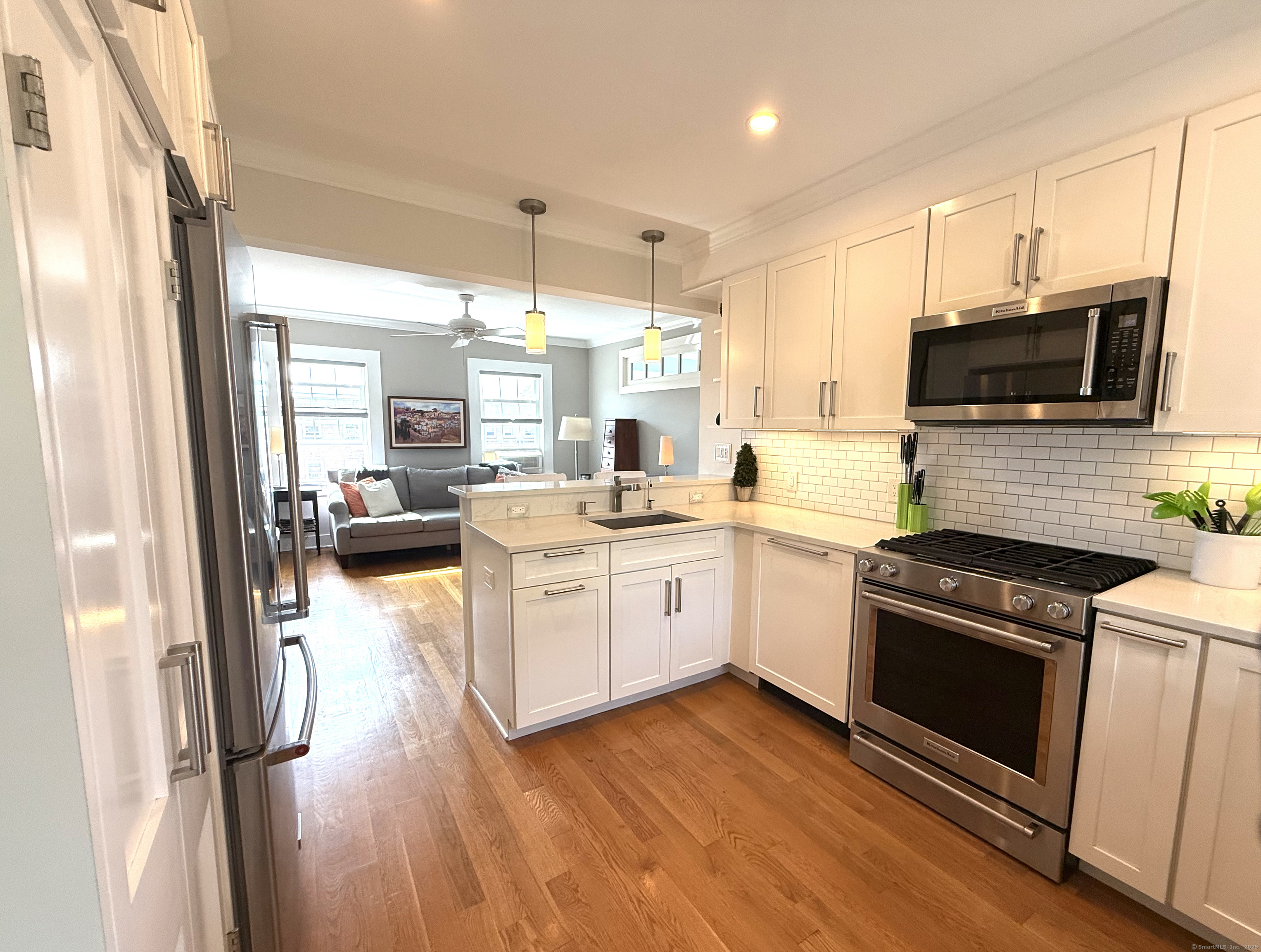 20 Haddon Street, Unit 5 Bridgeport, CT 06605 - Photo 19 of 40 a kitchen with a stove a sink and a microwave