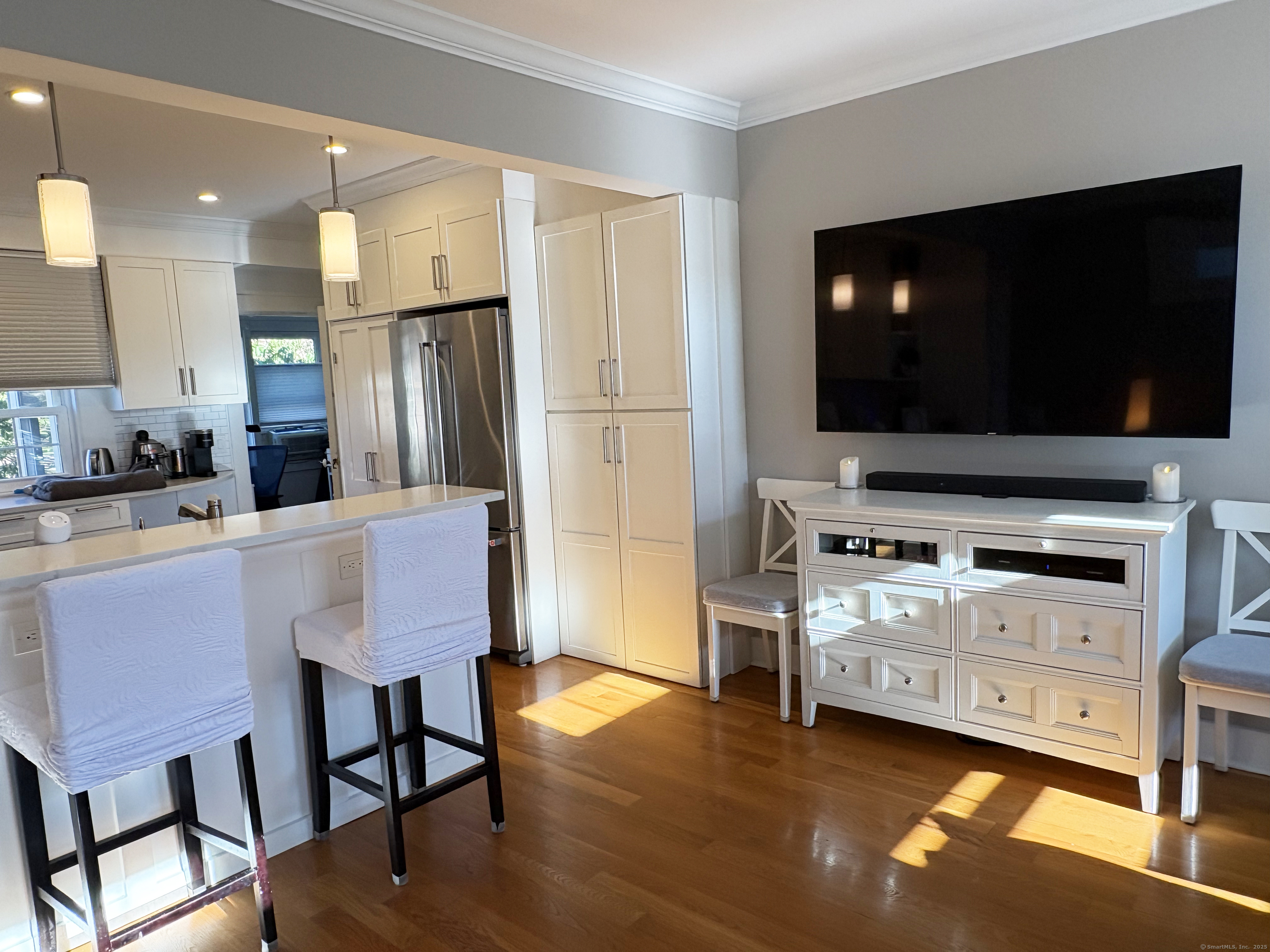 20 Haddon Street, Unit 5 Bridgeport, CT 06605 - Photo 6 of 40 a kitchen with stainless steel appliances a stove a refrigerator and a fireplace