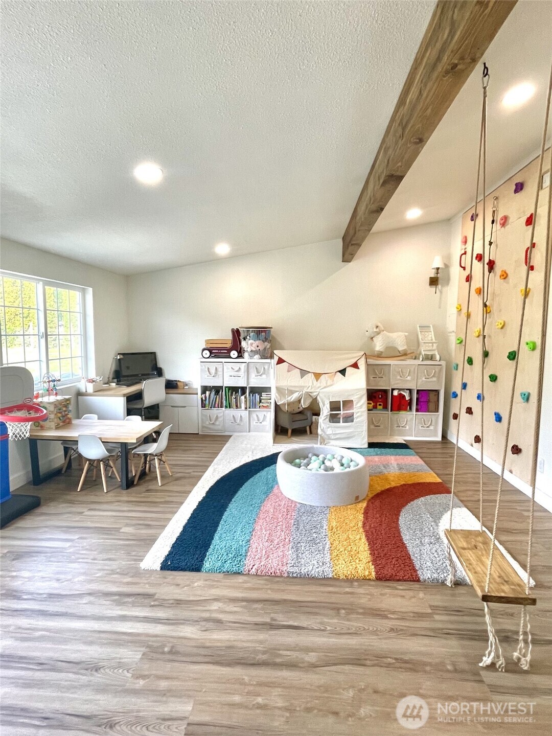 6694 Mae Valley Road Northeast Moses Lake, WA 98837 - Photo 15 of 26 a living room with lots of furniture and a wooden floor