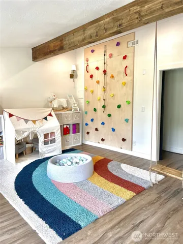 a bathroom with a sink mirror and shower curtain