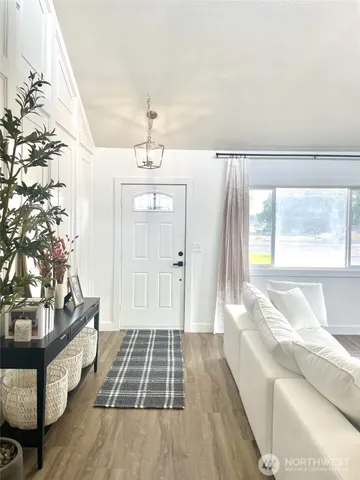 a spacious bedroom with a bed and a window