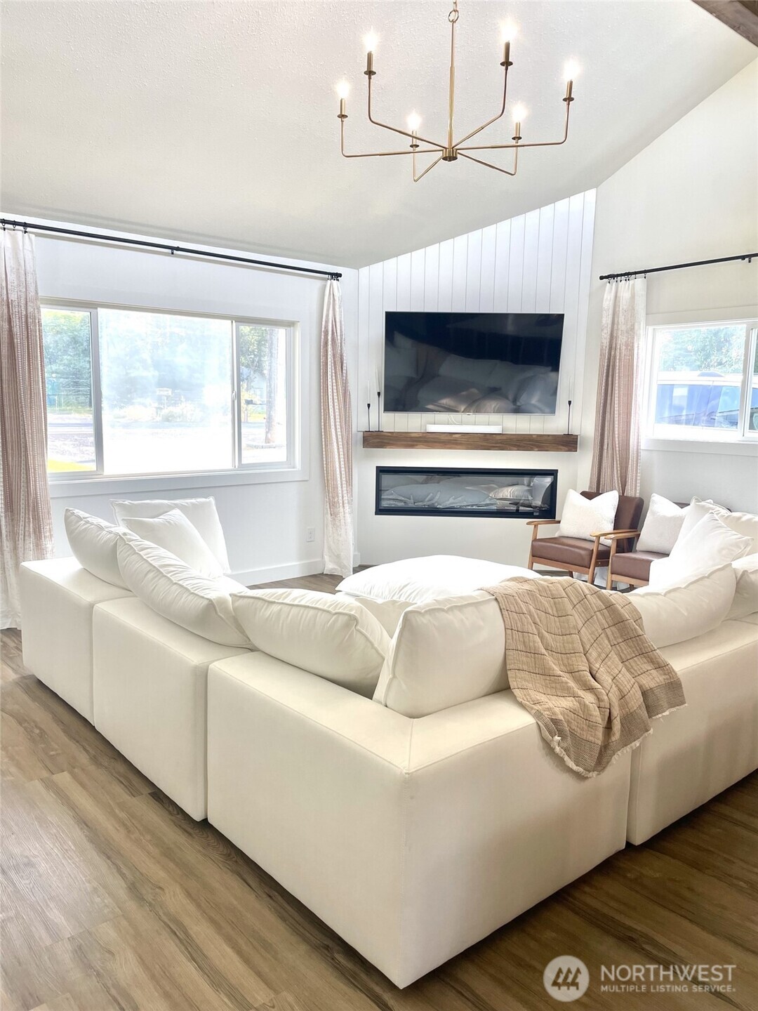 6694 Mae Valley Road Northeast Moses Lake, WA 98837 - Photo 5 of 26 a living room with furniture and a fireplace