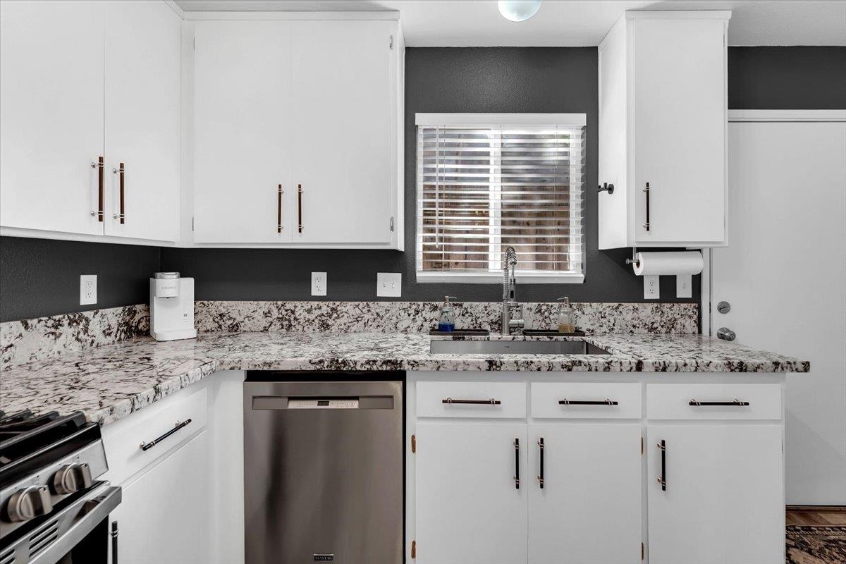 2110 Gentry Way Red Bluff, CA 96080 - Photo 12 of 47 a kitchen with granite countertop a sink and a stove