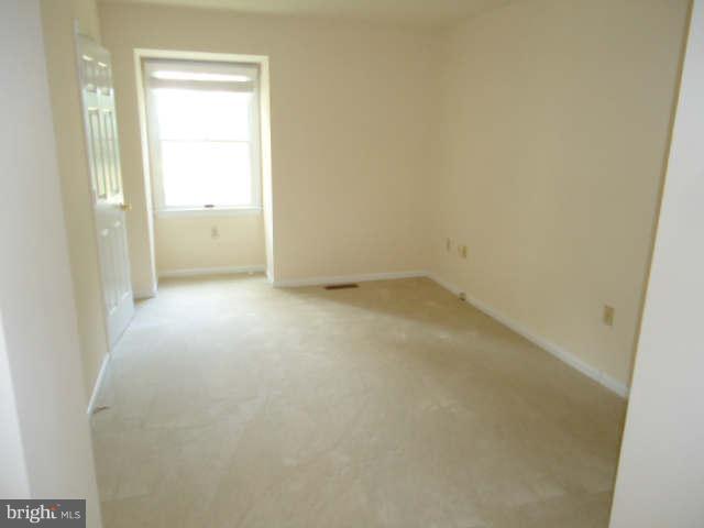 6838 Warfield Road Gaithersburg, MD 20882 - Photo 15 of 17 a view of an empty room and a window