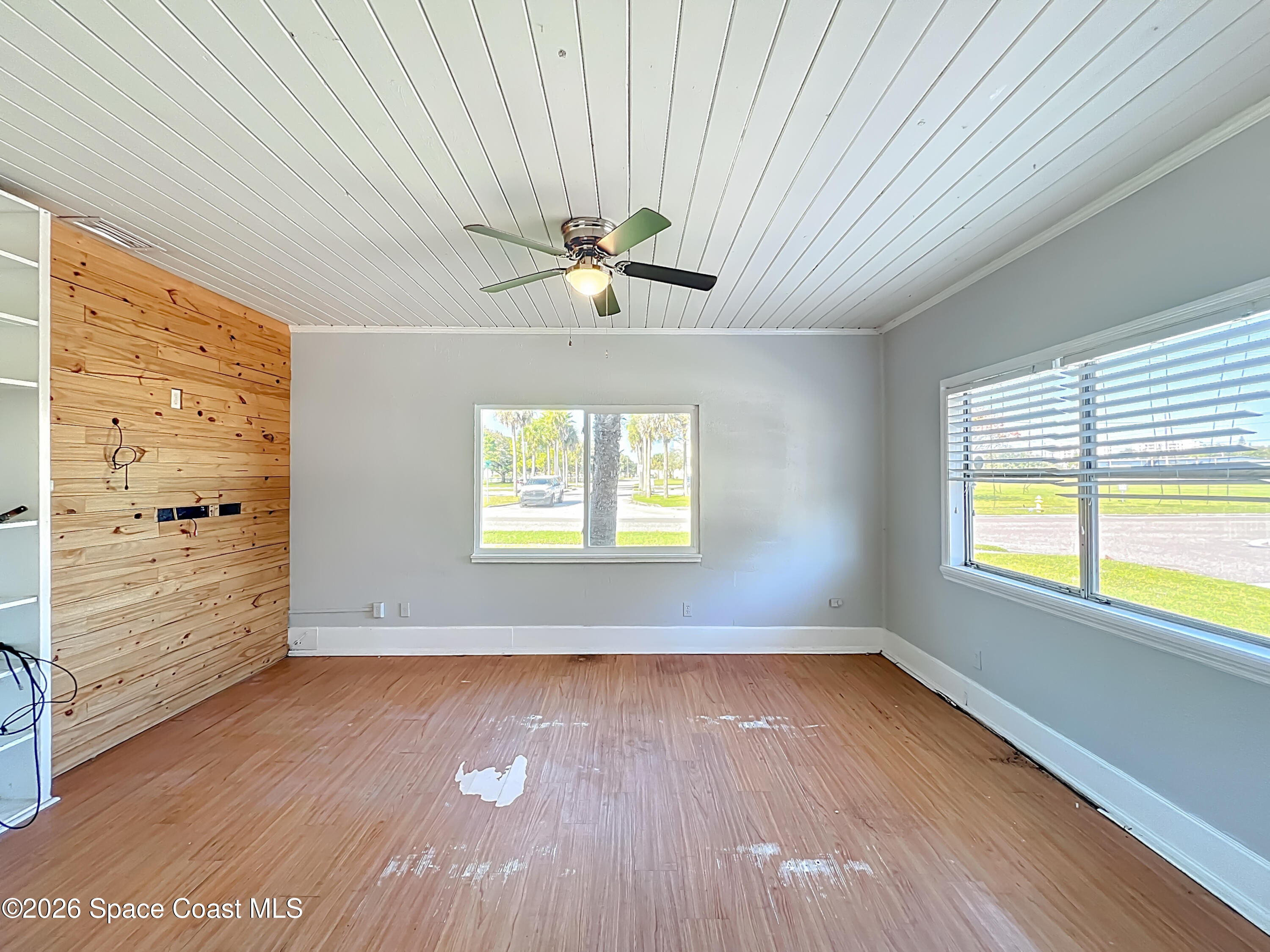 541 East Fee Avenue Melbourne, FL 32901 - Photo 11 of 28 wooden floor in an empty room with a window