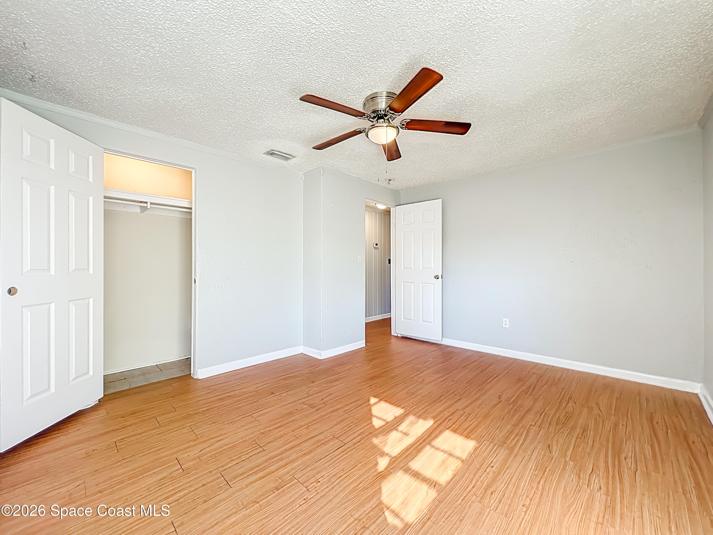 541 East Fee Avenue Melbourne, FL 32901 - Photo 20 of 28 a view of a big room with wooden floor and windows in a room