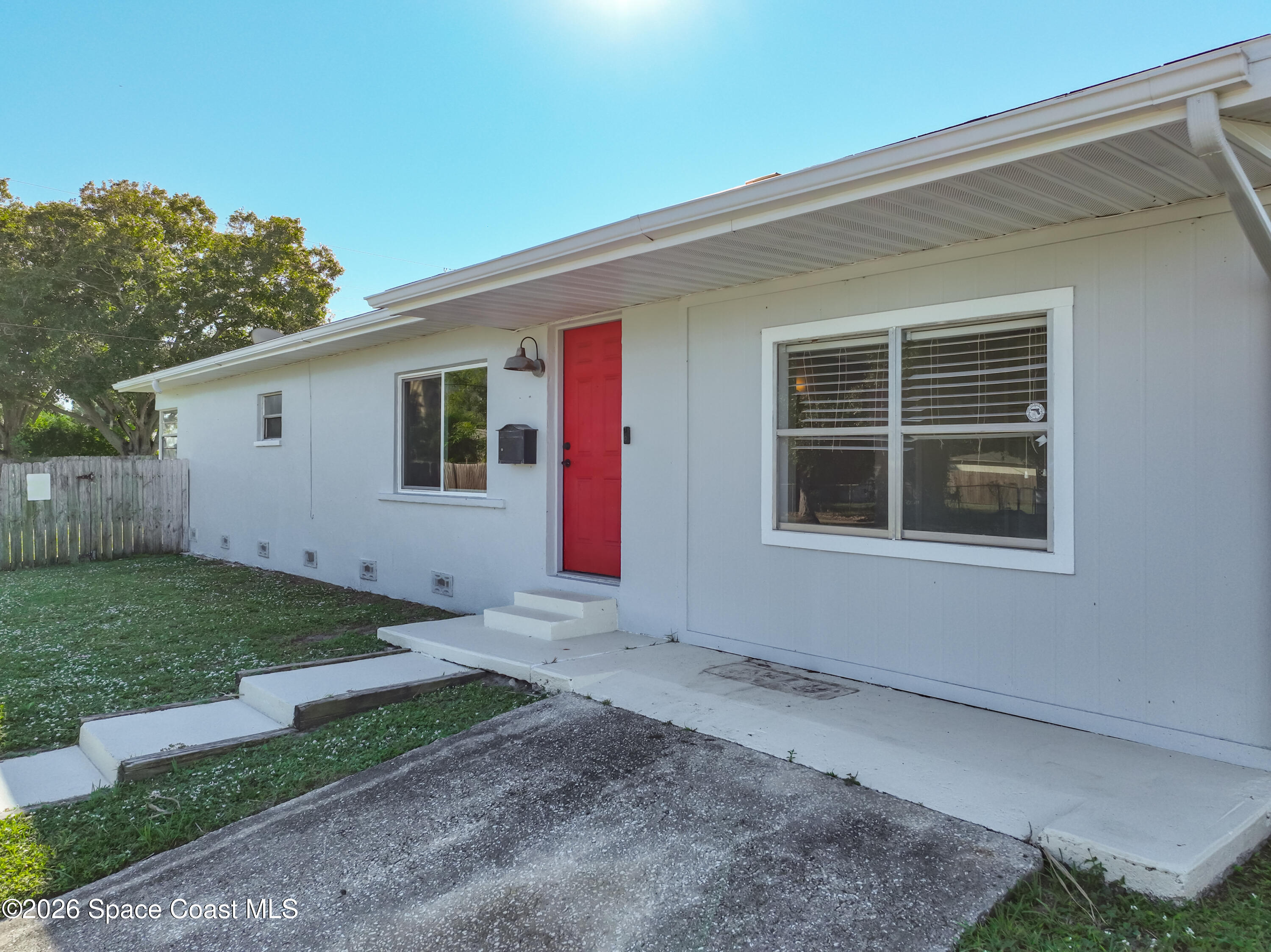541 East Fee Avenue Melbourne, FL 32901 - Photo 2 of 28 a house with trees in the background