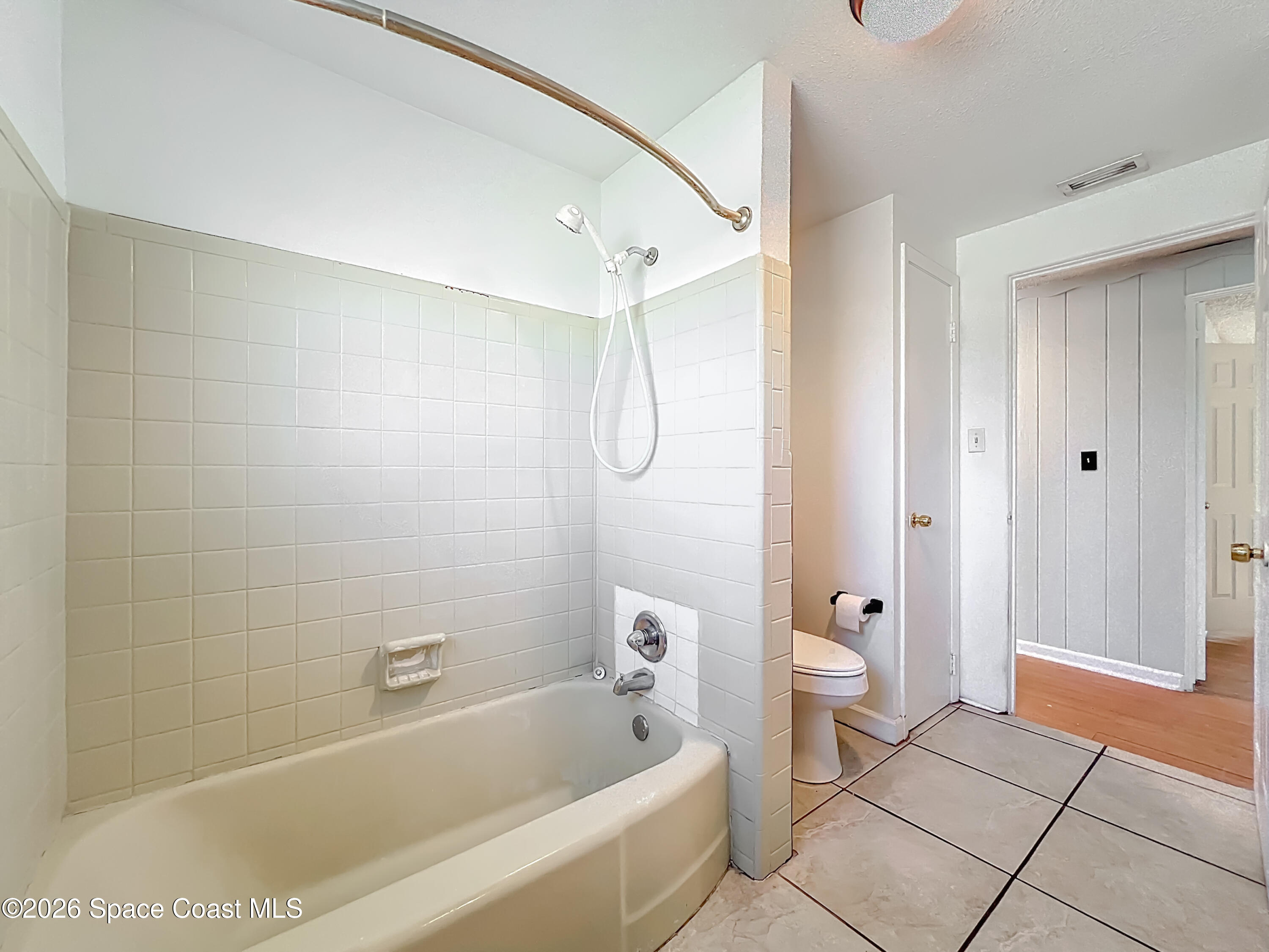 541 East Fee Avenue Melbourne, FL 32901 - Photo 22 of 28 a bathroom with a bathtub and a shower