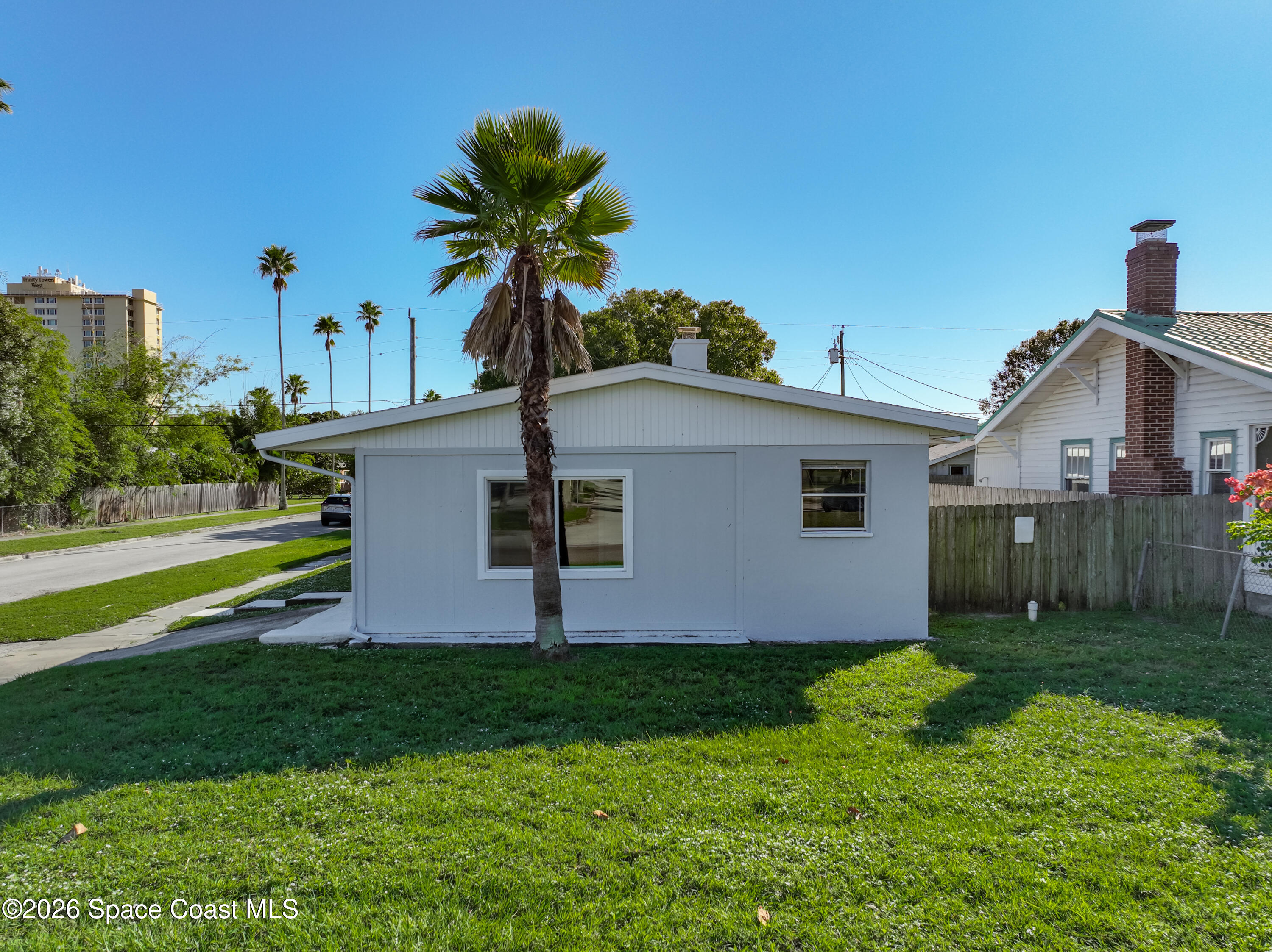 541 East Fee Avenue Melbourne, FL 32901 - Photo 25 of 28 a front view of house with yard and green space