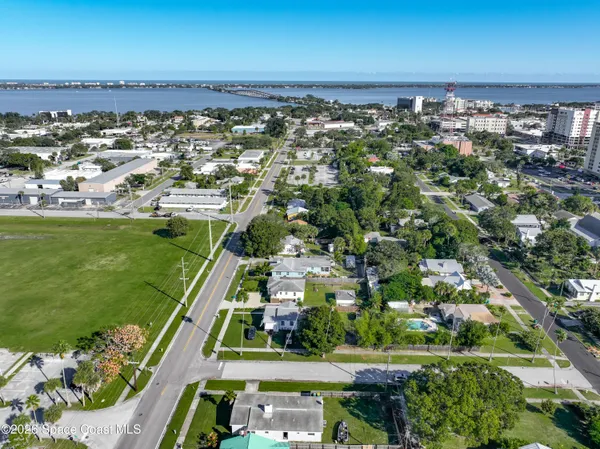an aerial view of residential houses with outdoor space