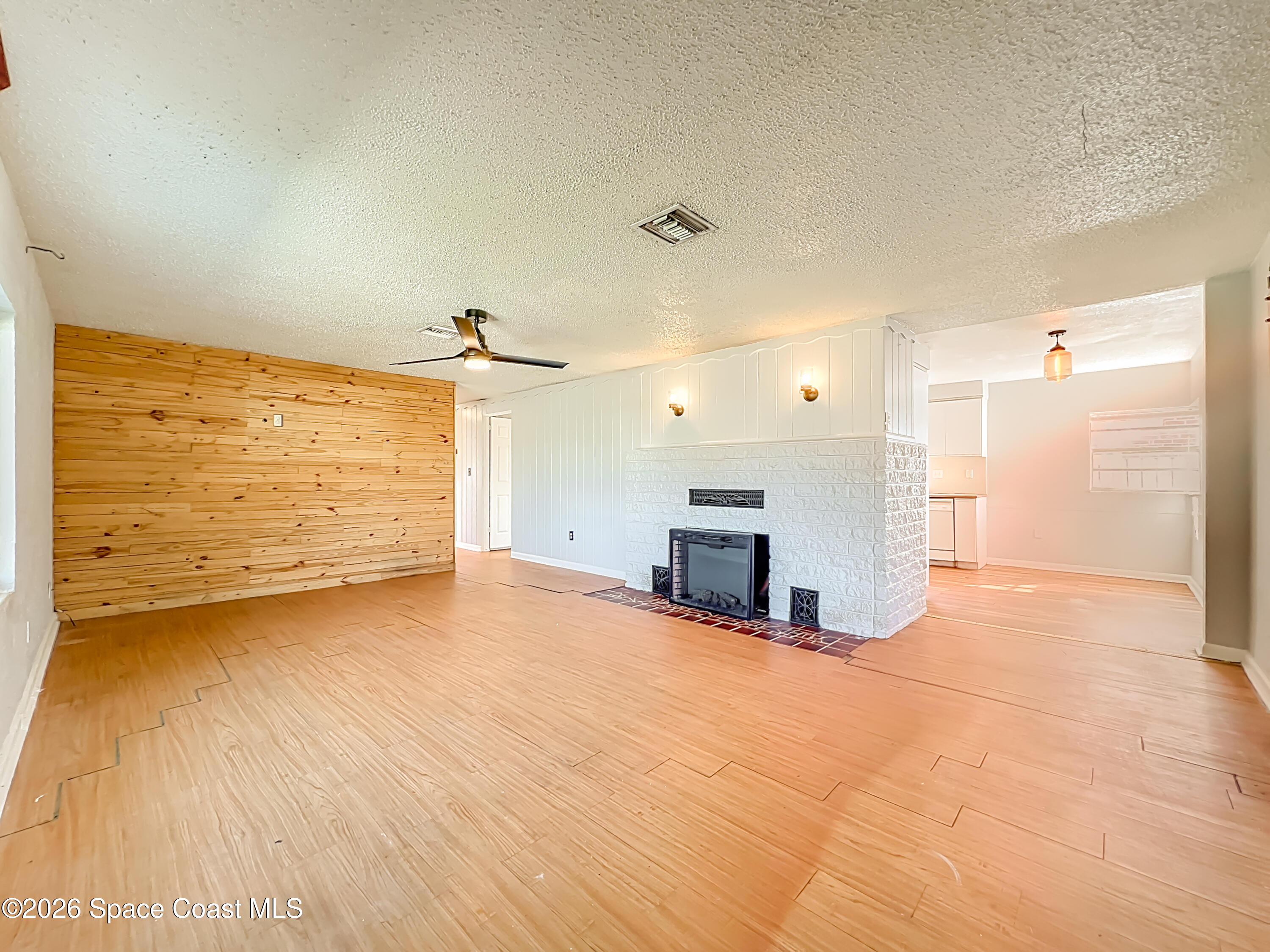 541 East Fee Avenue Melbourne, FL 32901 - Photo 4 of 28 a view of a room with kitchen appliances and wooden floor