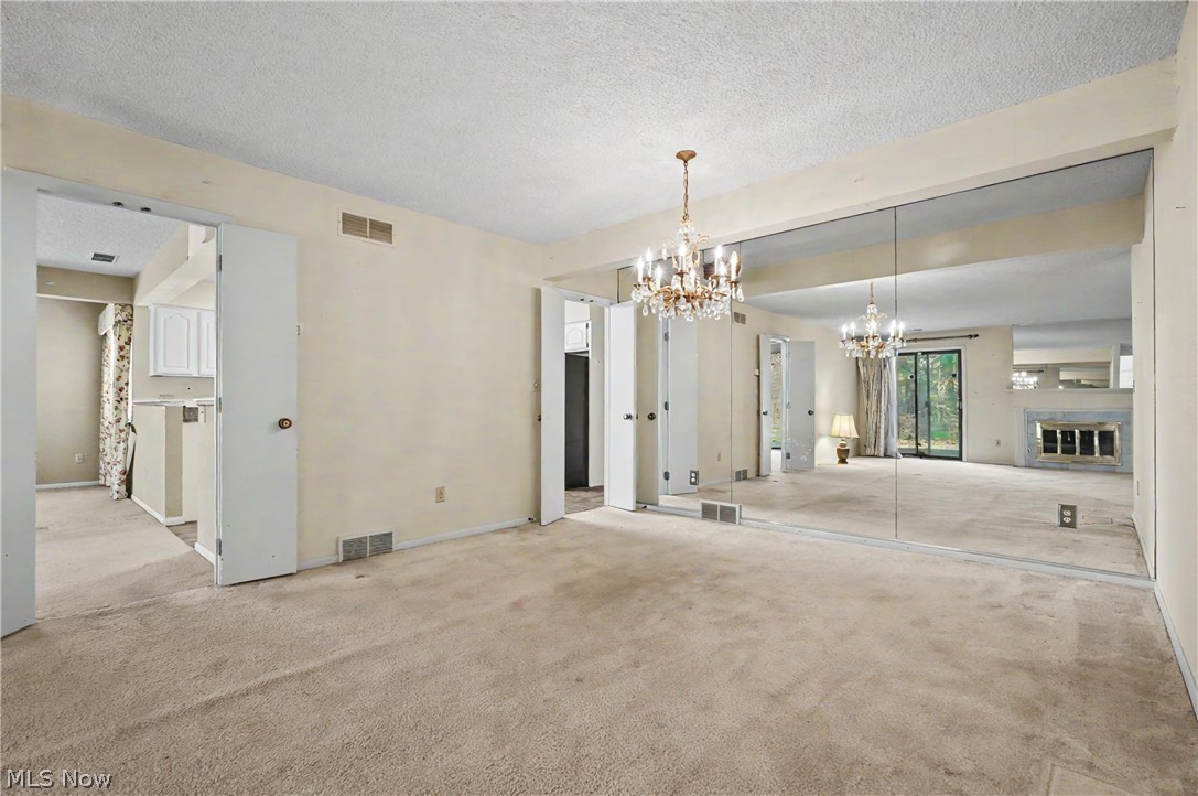 624 Hampton Ridge Drive Akron, OH 44313 - Photo 11 of 46 Dining area at back of living room, looking toward family room and kitchen.