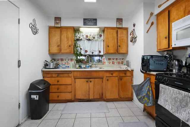 a bathroom with a sink toilet and mirror