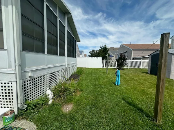a backyard of a house with outdoor seating