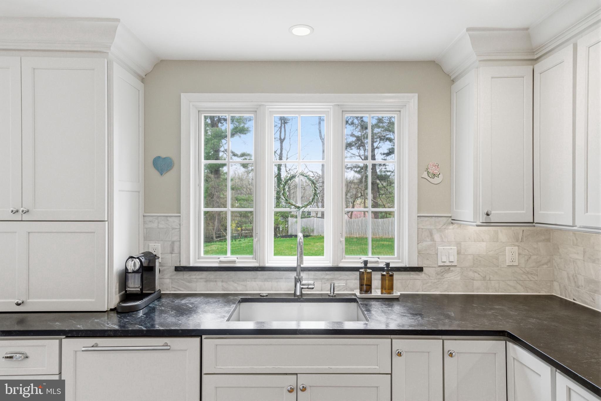 371 Margo Lane Berwyn, PA 19312 - Photo 17 of 68 a kitchen with granite countertop a sink and a window