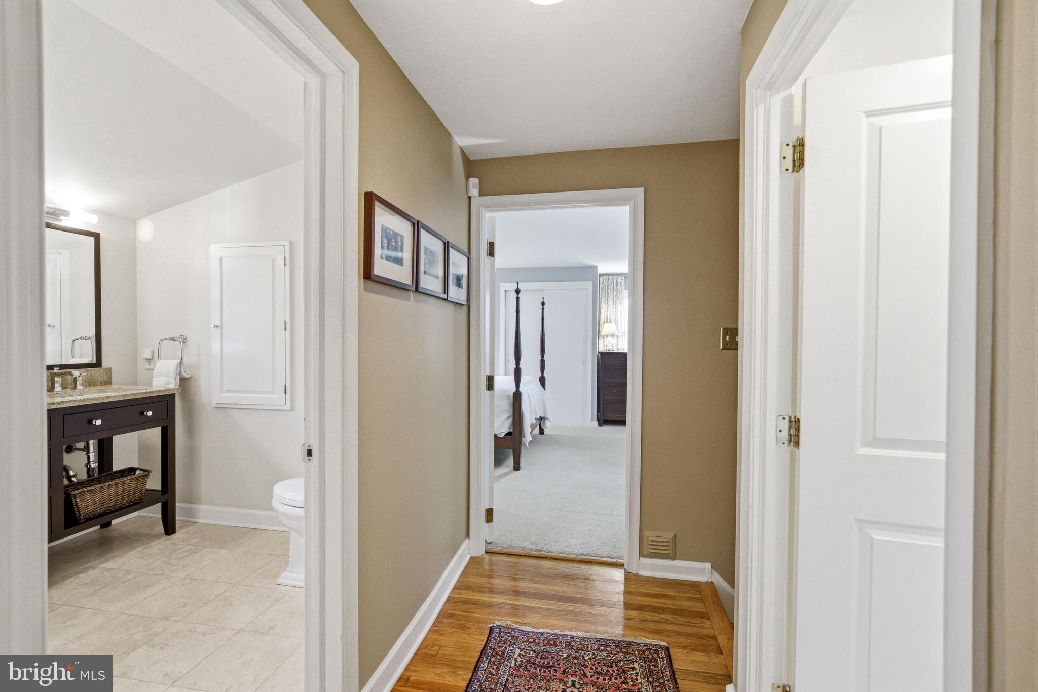 371 Margo Lane Berwyn, PA 19312 - Photo 35 of 68 a view of a hallway with wooden floor and a bathroom