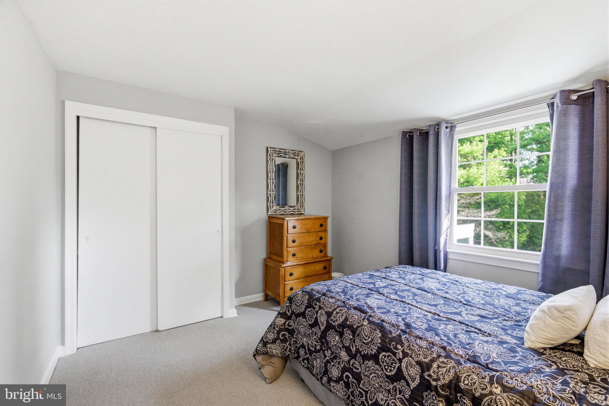 371 Margo Lane Berwyn, PA 19312 - Photo 42 of 68 a bedroom with a bed and wooden floor
