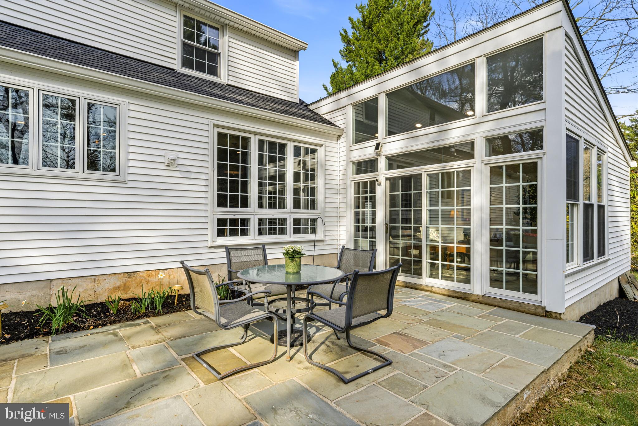 371 Margo Lane Berwyn, PA 19312 - Photo 50 of 68 a view of a patio with table and chairs and wooden fence