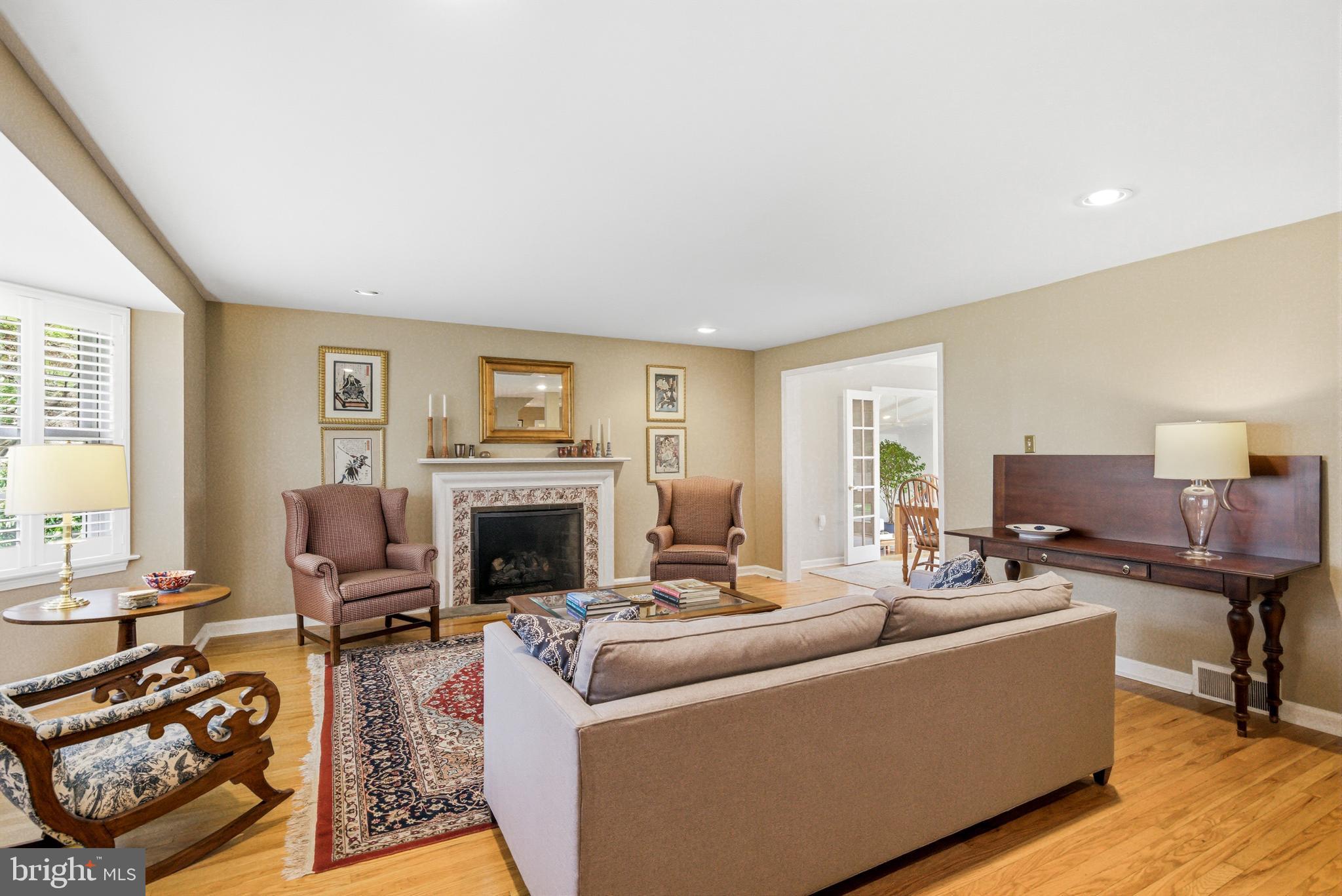 371 Margo Lane Berwyn, PA 19312 - Photo 6 of 68 a living room with furniture a fireplace and a large window