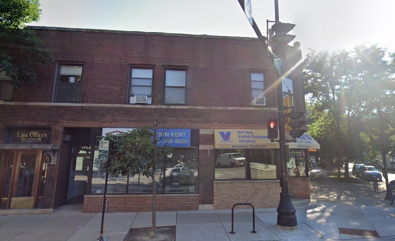 a front view of a building with outdoor space