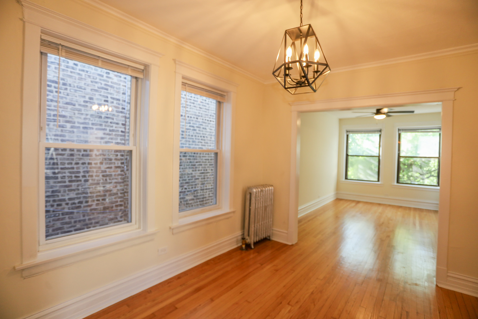 1848 West Grace Street, Unit 2E Chicago, IL 60613 - Photo 9 of 13 a view of an empty room with wooden floor and a window