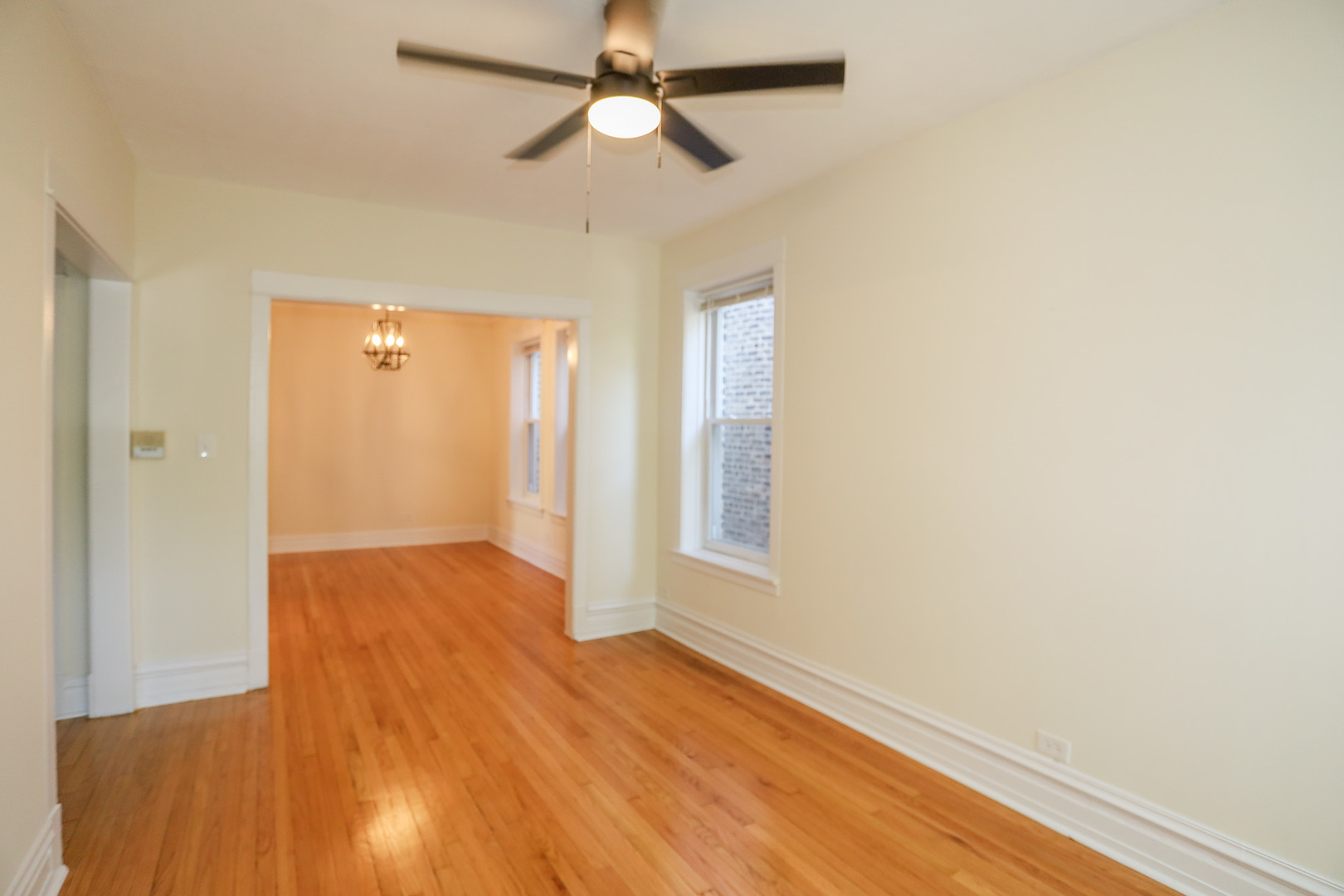 1848 West Grace Street, Unit 2E Chicago, IL 60613 - Photo 10 of 13 an empty room with wooden floor closet and windows