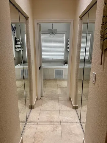 a bathroom with a shower and closet