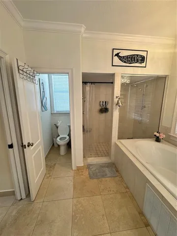 a bathroom with a sink a toilet and a shower