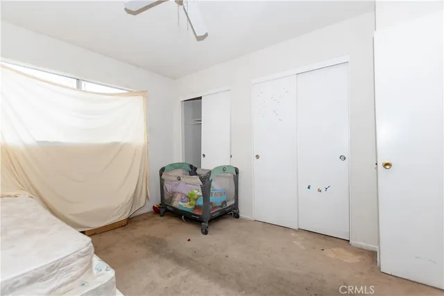 a view of room with window and furniture