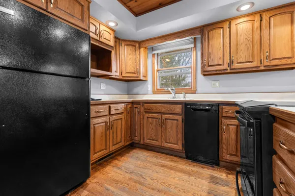 a kitchen with stainless steel appliances granite countertop a refrigerator and sink