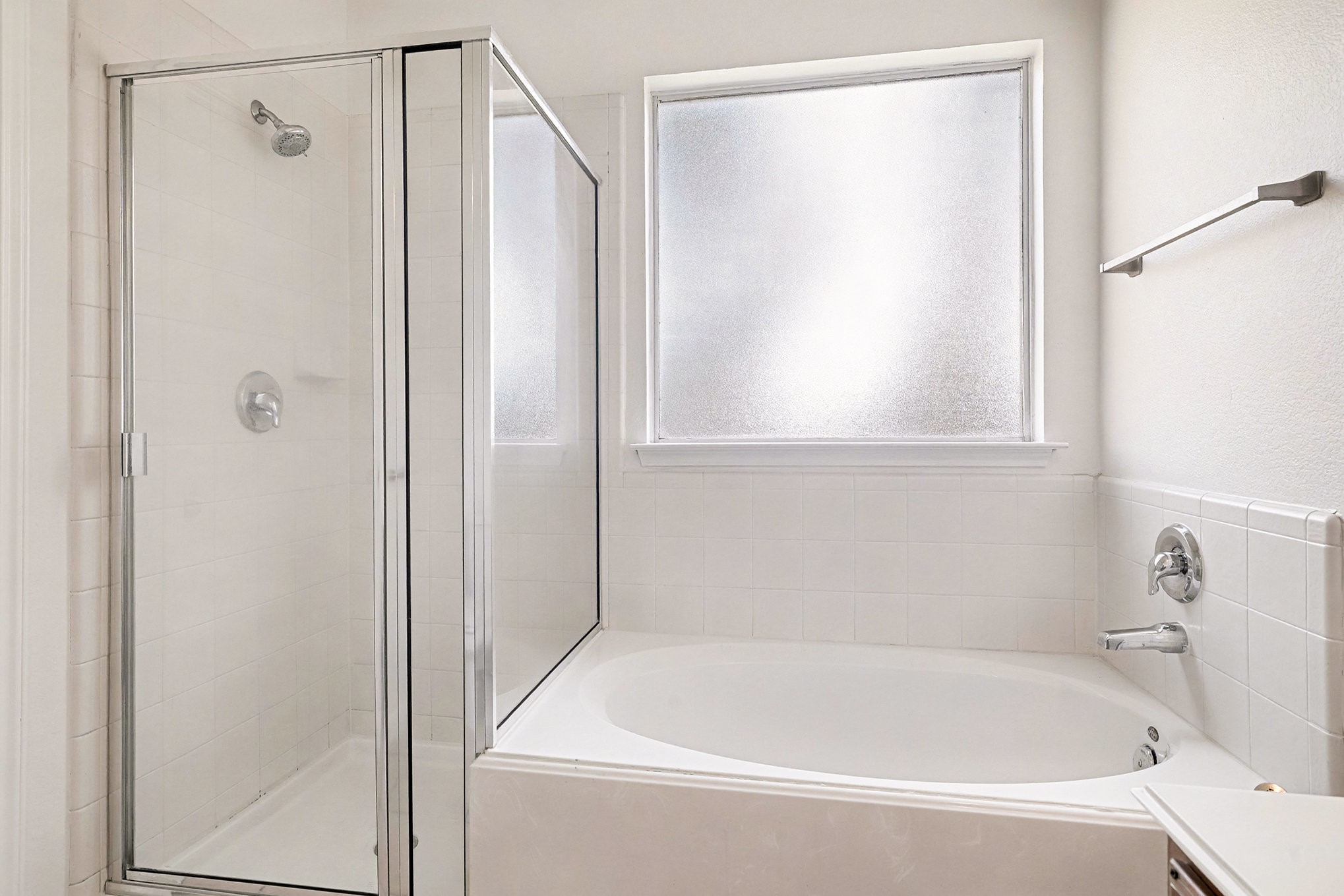 2710 Sleepy Knoll Drive Spring, TX 77373 - Photo 10 of 16 a white bath tub with a shower