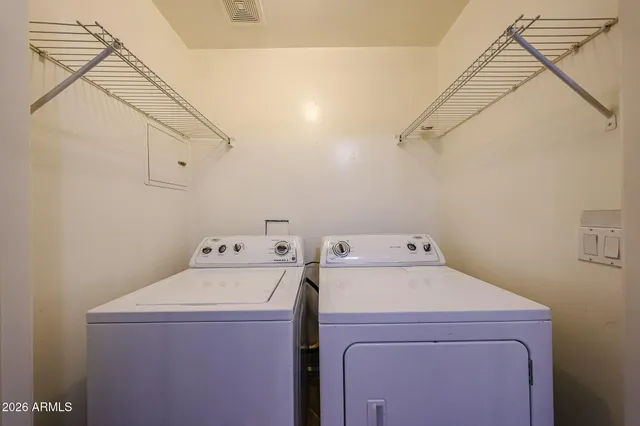 a utility room with dryer and washer