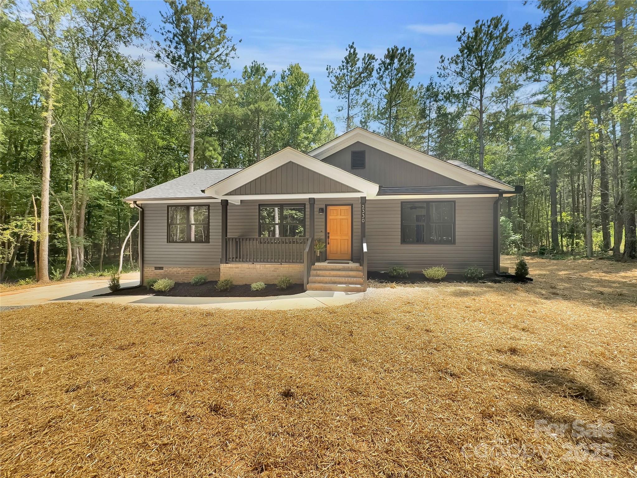 2330 Neill Road Lancaster, SC 29720 - Photo 1 of 39 a front view of a house with a garden