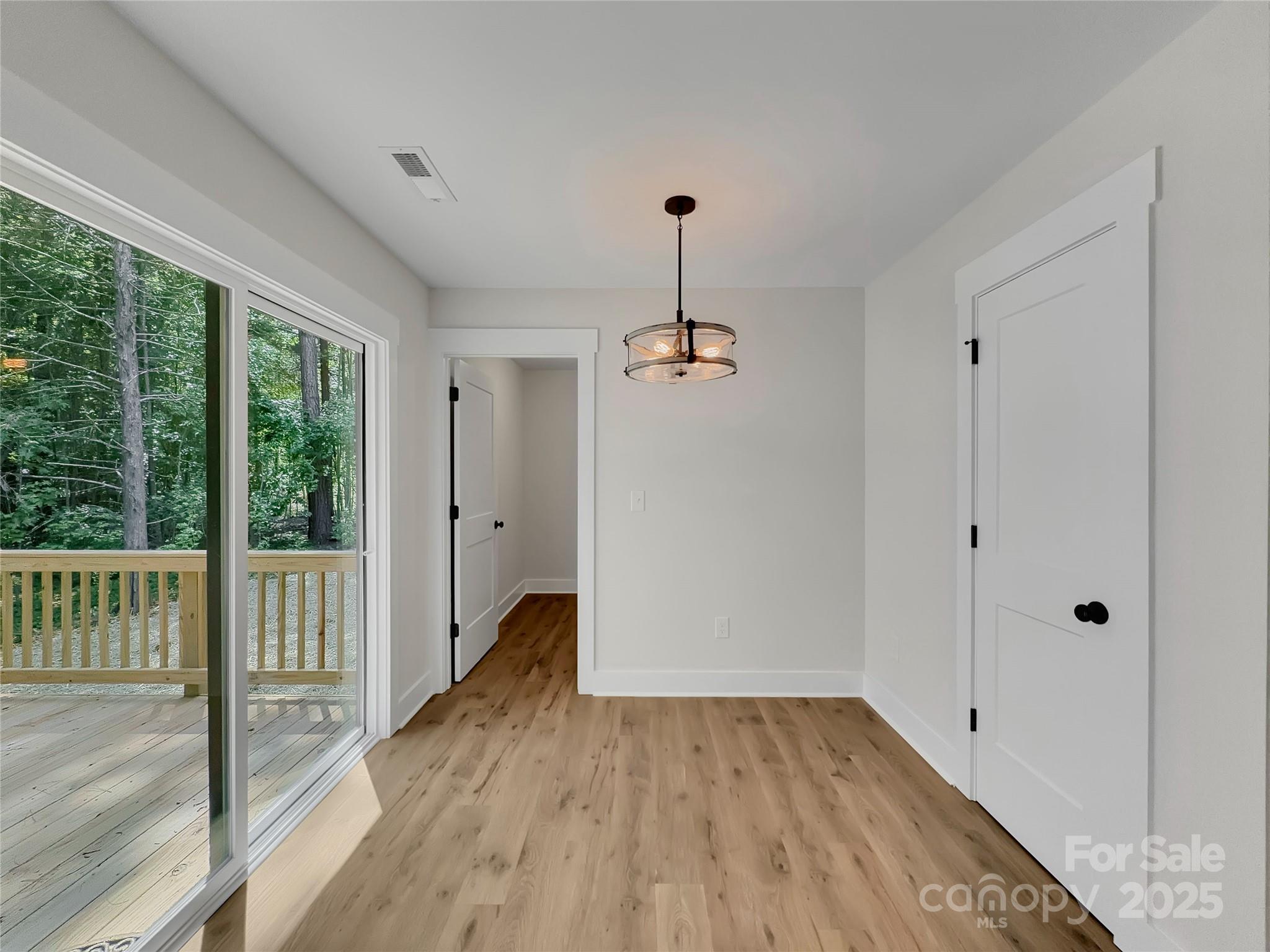 2330 Neill Road Lancaster, SC 29720 - Photo 17 of 39 a view of empty room with wooden floor and fan