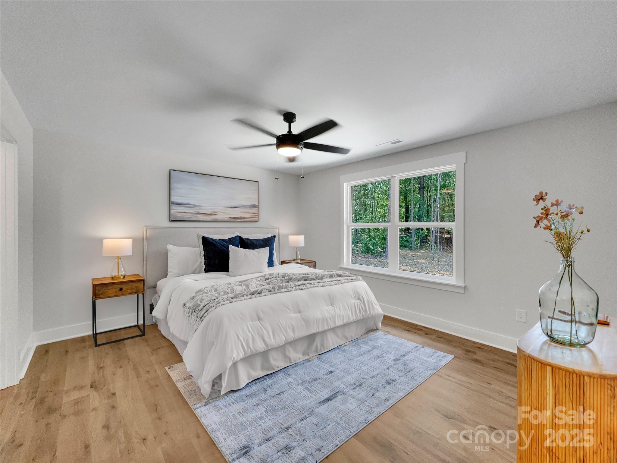 2330 Neill Road Lancaster, SC 29720 - Photo 19 of 39 a bedroom with a bed and wooden floor