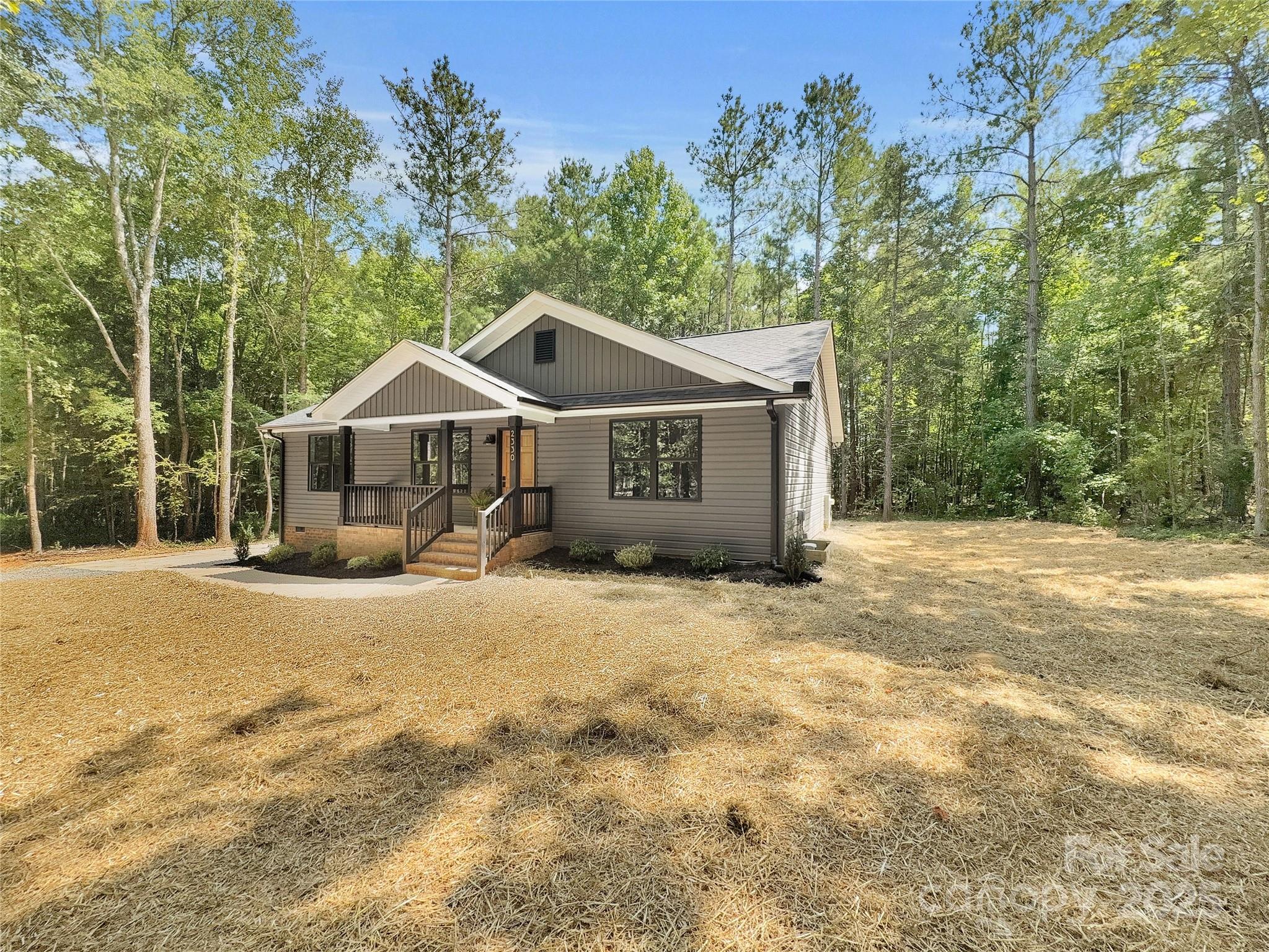 2330 Neill Road Lancaster, SC 29720 - Photo 3 of 39 a front view of a house with a yard and garage