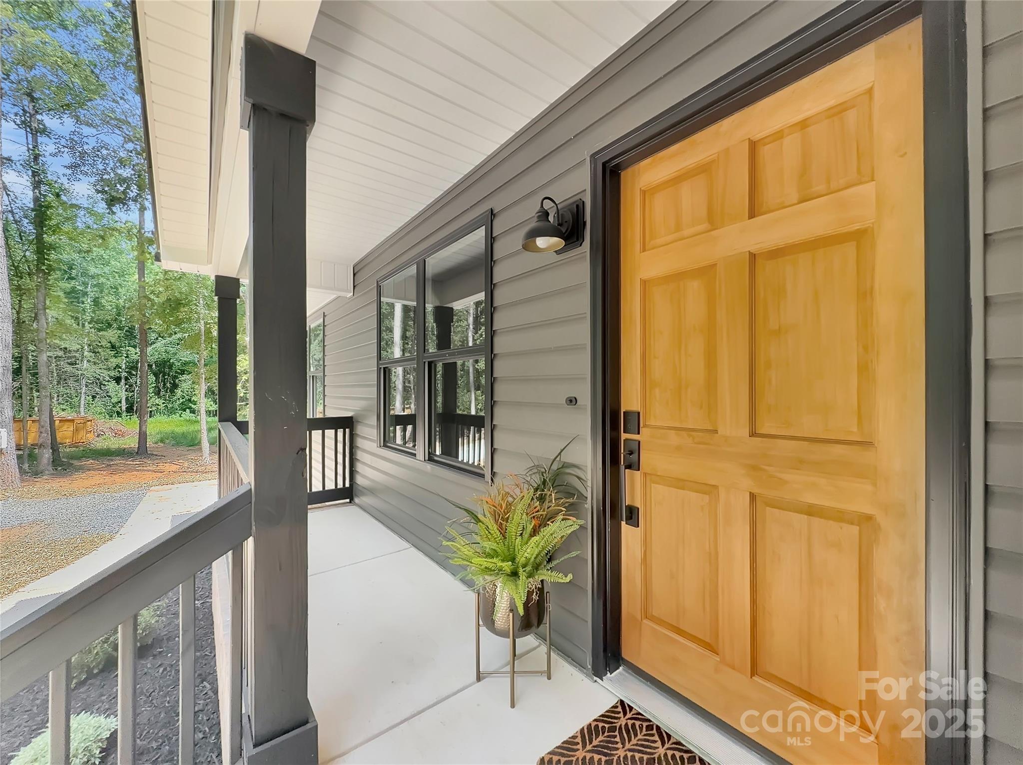 2330 Neill Road Lancaster, SC 29720 - Photo 5 of 39 a view of a balcony with chairs and floor to ceiling window