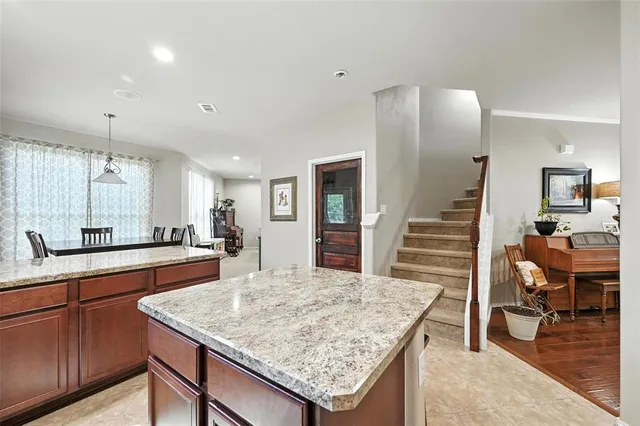 a kitchen with sink and center island