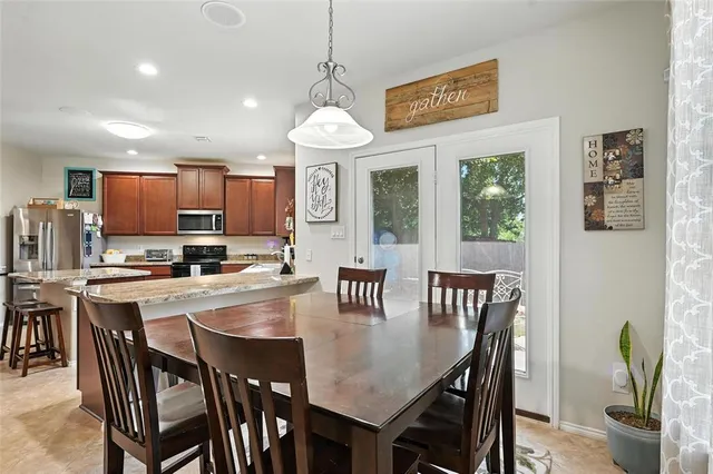 a view of a dining room with furniture window and outside view