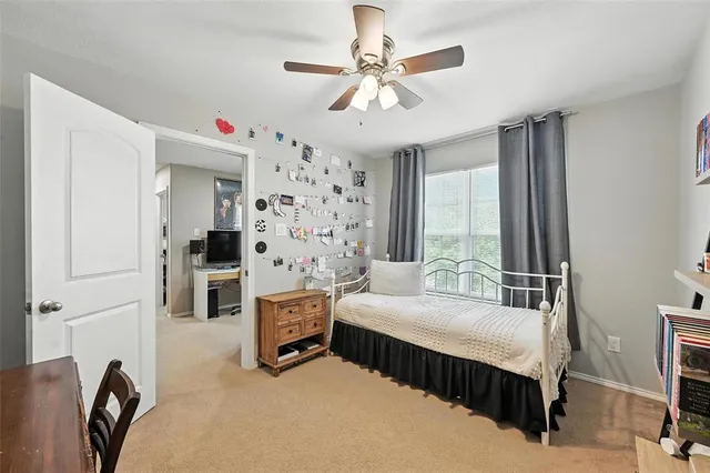 a bedroom with a bed dresser and a window