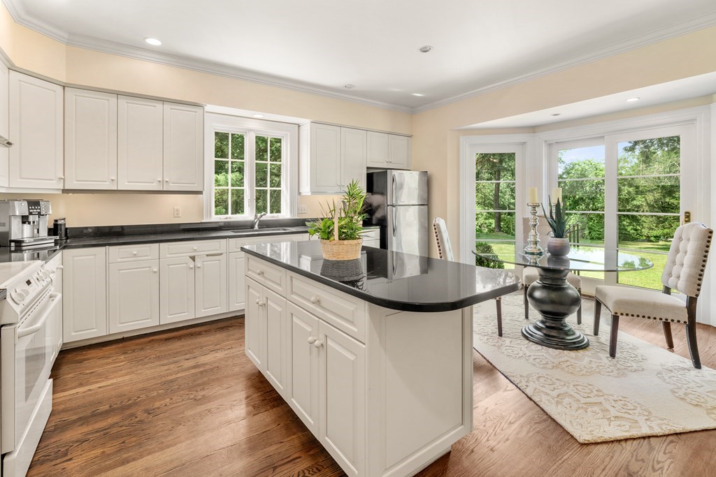 1 Rocky Ridge Road Dedham, MA 02026 - Photo 11 of 38 a kitchen with sink a stove and cabinets